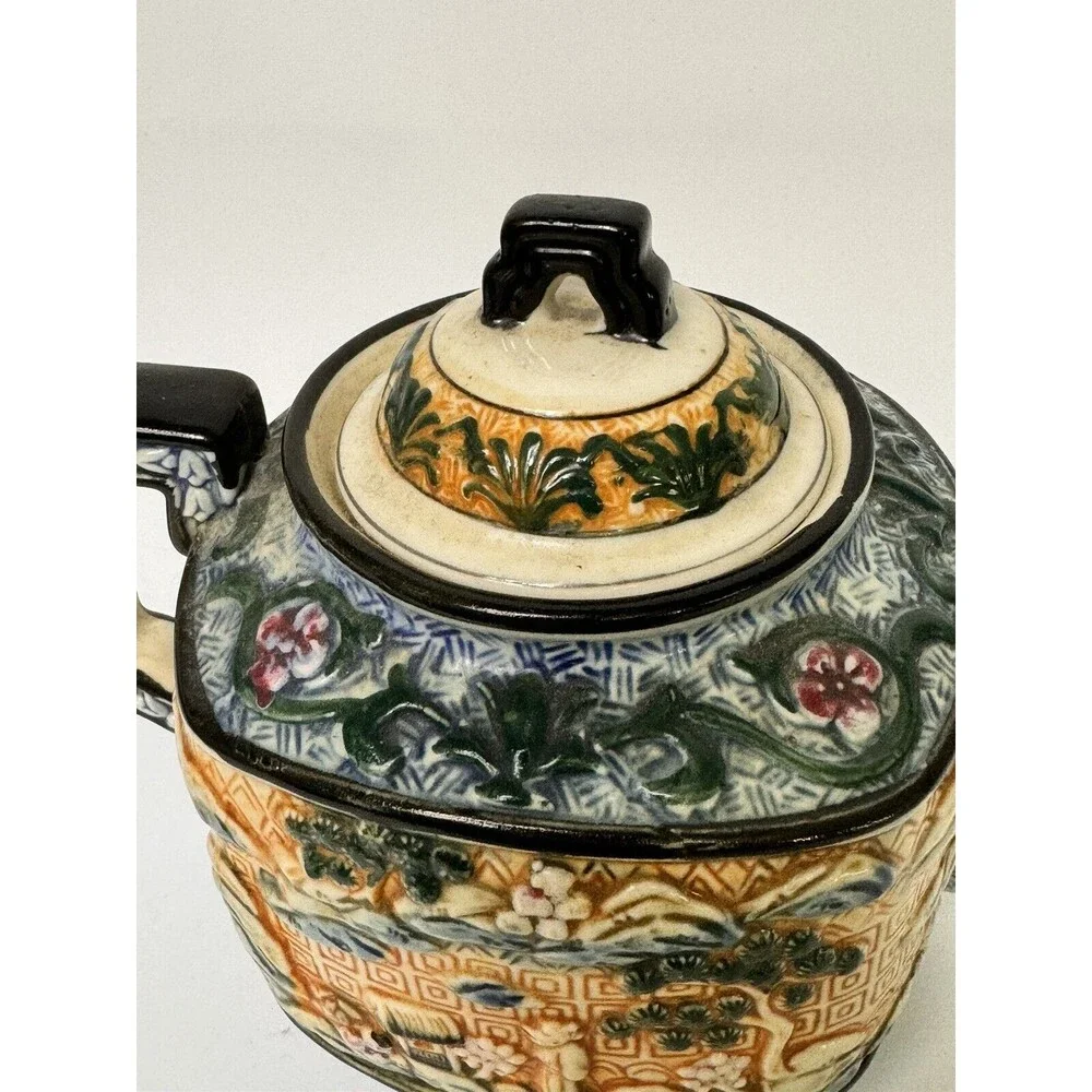 Teapot- vintage ceramic raised Asian  9 inches by 7 Inches
